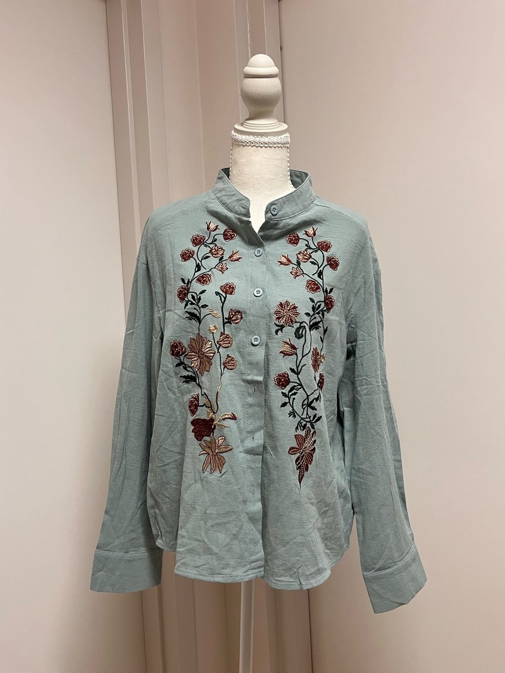 Blue embroidered floral button up blouse, size L.